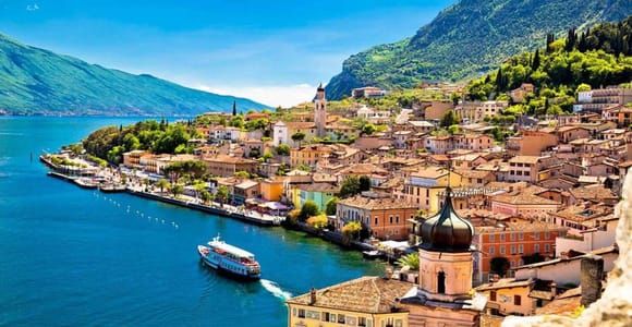 Admire Lake Garda's crystal clear water from/to Milan